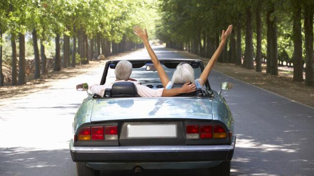 Senior couple in sports car